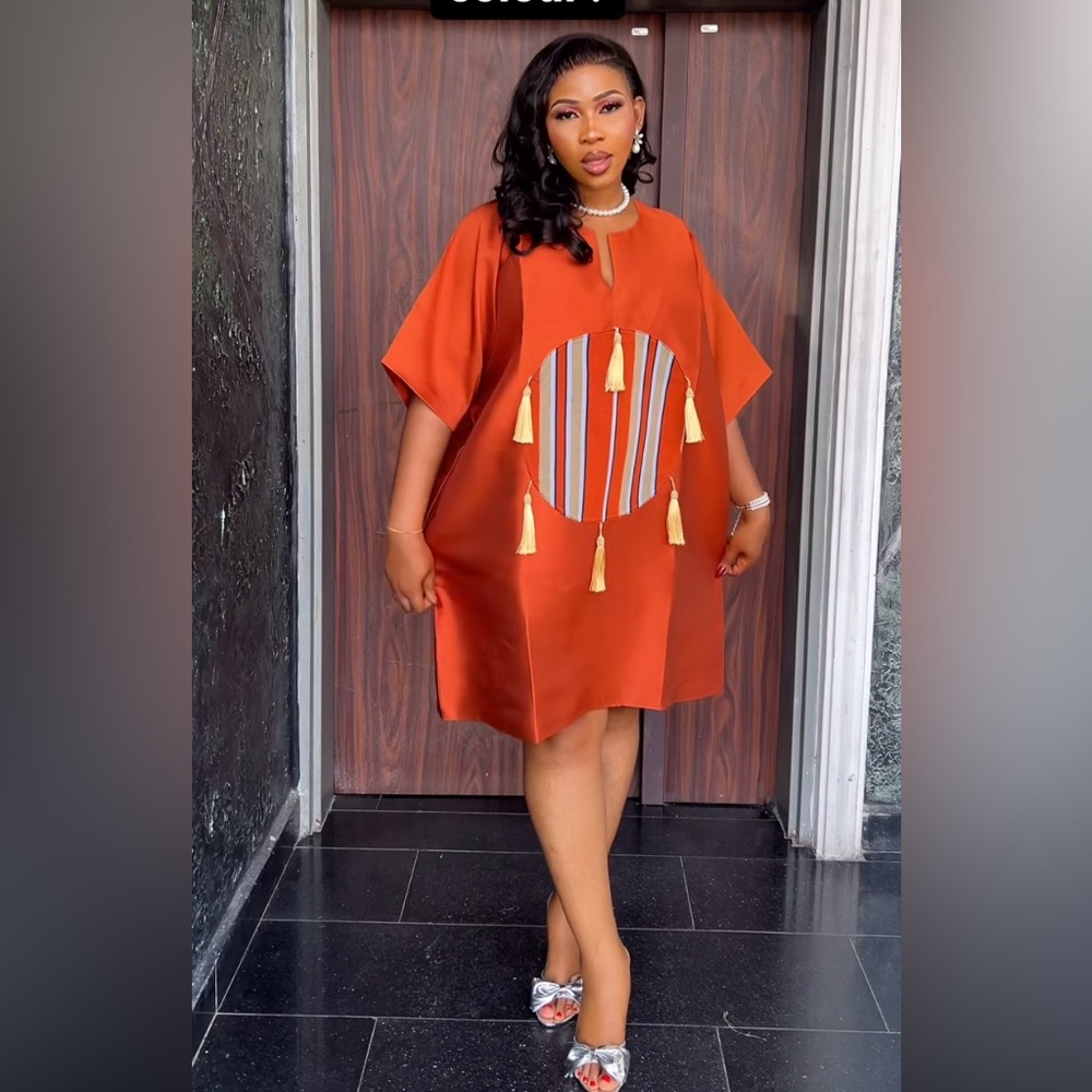 Elegant Orange Dress with Tassel Details